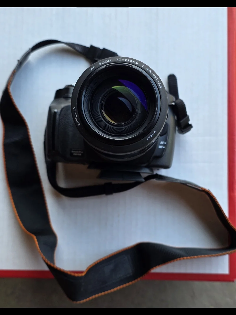 Sony Black DSLR Camera with Black Bag and Orange Interior